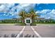 Community clubhouse with palm trees and ample parking at 5035 Kiva Cir, Bradenton, FL 34211