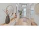 Bright and airy entryway with light wood floors at 5035 Kiva Cir, Bradenton, FL 34211