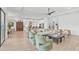 Open concept living room showcasing a chic aesthetic and hardwood flooring at 5035 Kiva Cir, Bradenton, FL 34211