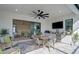 Covered outdoor kitchen with dining area, built-in appliances, and ceiling fan at 5035 Kiva Cir, Bradenton, FL 34211