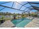 Relaxing screened-in pool with lake view at 5035 Kiva Cir, Bradenton, FL 34211