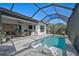 Relaxing pool and patio area with covered lanai and lounge chairs at 5035 Kiva Cir, Bradenton, FL 34211