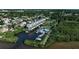 Aerial view of waterfront community, tennis court, and boat slips at 515 Leffingwell Ave # 109, Ellenton, FL 34222