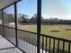 Screened balcony overlooking a lush green lawn at 515 Leffingwell Ave # 109, Ellenton, FL 34222