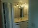 Bathroom boasting a vanity with a large mirror at 515 Leffingwell Ave # 109, Ellenton, FL 34222