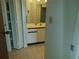 Bathroom with white cabinets and a tiled floor at 515 Leffingwell Ave # 109, Ellenton, FL 34222