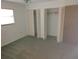 Spacious bedroom with double closets and neutral carpeting at 515 Leffingwell Ave # 109, Ellenton, FL 34222