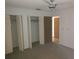 Bright bedroom with double closets and neutral carpeting at 515 Leffingwell Ave # 109, Ellenton, FL 34222