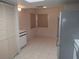 Kitchen area with white cabinets and tile floor at 515 Leffingwell Ave # 109, Ellenton, FL 34222