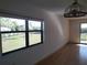 Living room with large window and patio access at 515 Leffingwell Ave # 109, Ellenton, FL 34222