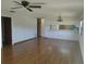 Living room with laminate floors and ceiling fan at 515 Leffingwell Ave # 109, Ellenton, FL 34222