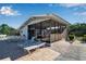 Screened poolside patio with lounge chairs at 515 Leffingwell Ave # 109, Ellenton, FL 34222