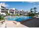 Community pool with patio and surrounding building views at 515 Leffingwell Ave # 109, Ellenton, FL 34222