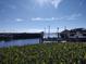 Serene waterfront view with lush vegetation and boats at 515 Leffingwell Ave # 109, Ellenton, FL 34222