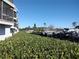 Waterfront view of building with lush vegetation at 515 Leffingwell Ave # 109, Ellenton, FL 34222