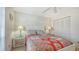 Charming bedroom with a queen-size bed and window coverings at 5242 Wedgewood Ln # 62, Sarasota, FL 34235