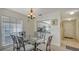 Dining area with table and chairs, open to kitchen at 5242 Wedgewood Ln # 62, Sarasota, FL 34235