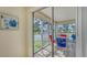 Screened lanai with table and chairs overlooking the water at 5242 Wedgewood Ln # 62, Sarasota, FL 34235