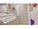 Convenient laundry room with washer, dryer, and storage shelves at 5242 Wedgewood Ln # 62, Sarasota, FL 34235