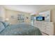 Main bedroom with king-size bed and access to a balcony at 5242 Wedgewood Ln # 62, Sarasota, FL 34235