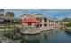 Clubhouse patio with water view and seating at 5242 Wedgewood Ln # 62, Sarasota, FL 34235