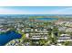 Aerial view of community, showcasing lakefront location and lush landscape at 527 Spring Lakes Blvd, Bradenton, FL 34210