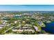 Aerial view of community with lake and surrounding landscape at 527 Spring Lakes Blvd, Bradenton, FL 34210