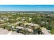 Aerial view showcasing condo complex and surrounding area at 527 Spring Lakes Blvd, Bradenton, FL 34210