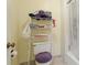 Bathroom with toilet, shower, and shelving unit at 527 Spring Lakes Blvd, Bradenton, FL 34210