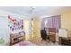 bedroom with crib, desk and storage at 527 Spring Lakes Blvd, Bradenton, FL 34210