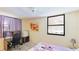 Bedroom with twin bed, desk and mini-fridge at 527 Spring Lakes Blvd, Bradenton, FL 34210