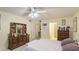 Bedroom with king-size bed, dresser, and access to bathroom at 527 Spring Lakes Blvd, Bradenton, FL 34210