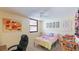 Cozy bedroom with a twin-size bed and workspace at 527 Spring Lakes Blvd, Bradenton, FL 34210