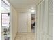 Condo entry with tile floors and built-in storage at 527 Spring Lakes Blvd, Bradenton, FL 34210