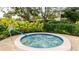 Relaxing community hot tub with surrounding landscaping and seating at 527 Spring Lakes Blvd, Bradenton, FL 34210