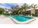Community pool with lounge chairs, offering a relaxing outdoor space at 527 Spring Lakes Blvd, Bradenton, FL 34210