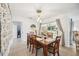 Bright dining area with wooden table and sliding doors to patio at 530 Saint Andrews Dr, Sarasota, FL 34243