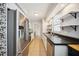 Clean kitchen with stainless steel appliances and view to backyard at 530 Saint Andrews Dr, Sarasota, FL 34243