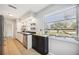 Updated kitchen with stainless steel appliances and a window overlooking the yard at 530 Saint Andrews Dr, Sarasota, FL 34243