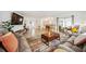 Open concept living space with stylish decor and large TV at 530 Saint Andrews Dr, Sarasota, FL 34243