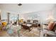 Relaxing living room with large sectional sofa and area rug at 530 Saint Andrews Dr, Sarasota, FL 34243