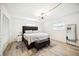 Spacious main bedroom with a king-size bed and an en-suite bathroom at 530 Saint Andrews Dr, Sarasota, FL 34243
