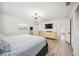 Main bedroom with king bed, dresser, and access to bathroom at 530 Saint Andrews Dr, Sarasota, FL 34243