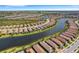 Aerial view of a house on a waterfront community, showcasing its location and surroundings at 5341 Popoli Way, Sarasota, FL 34238