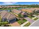 Community view with houses and a lake at 5341 Popoli Way, Sarasota, FL 34238
