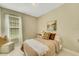 Cozy bedroom with a comfortable bed and neutral decor at 5341 Popoli Way, Sarasota, FL 34238