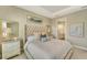Bright bedroom with a comfortable bed and ensuite access at 5341 Popoli Way, Sarasota, FL 34238
