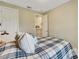 Spacious bedroom with ensuite access and comfortable bedding at 5341 Popoli Way, Sarasota, FL 34238