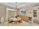 Bright dining room featuring a round table and light-toned furnishings at 5341 Popoli Way, Sarasota, FL 34238