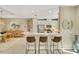 Modern kitchen with white cabinets and island at 5341 Popoli Way, Sarasota, FL 34238